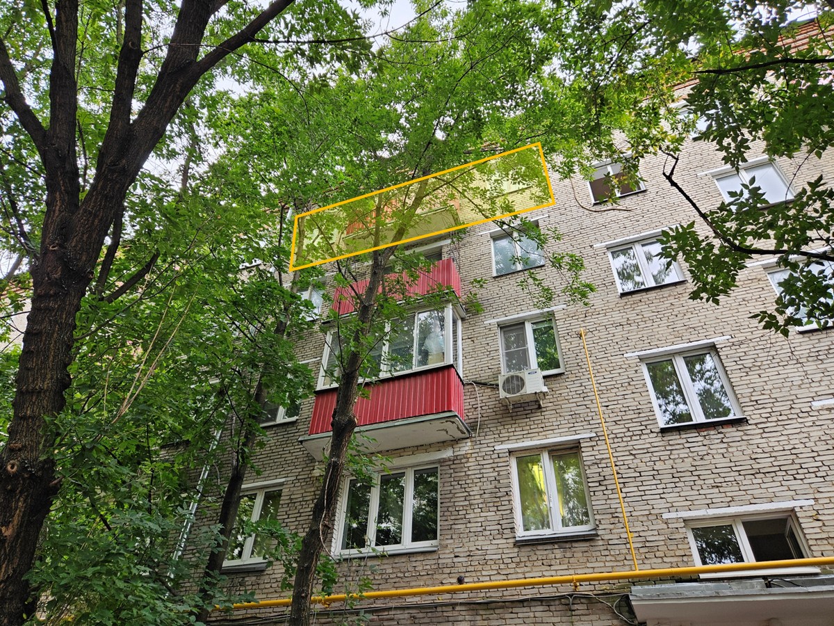 ГП16965076.Квартира.Фасад здания с выделенными окнами реализуемого объекта.jpg